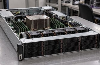 Open rack server on a laboratory workbench, showing a processor heatsink, memory modules and cooling fans.