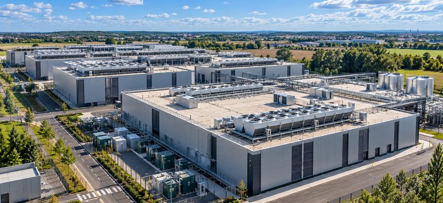 Aerial view of a modern European data center campus with cooling systems and electrical infrastructure, illustrating OVHcloud's 110MW spare power capacity for cloud and AI expansion.