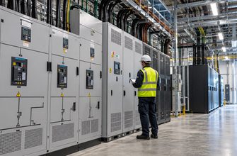 Electrical engineer inspecting power distribution cabinets and switchgear inside a modern data center, illustrating the Google Cloud London outage.